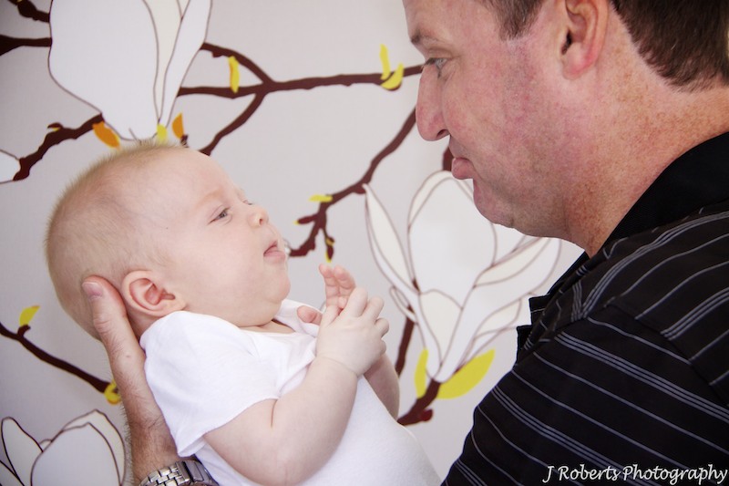 Dad making baby laugh - baby portrait photography sydney
